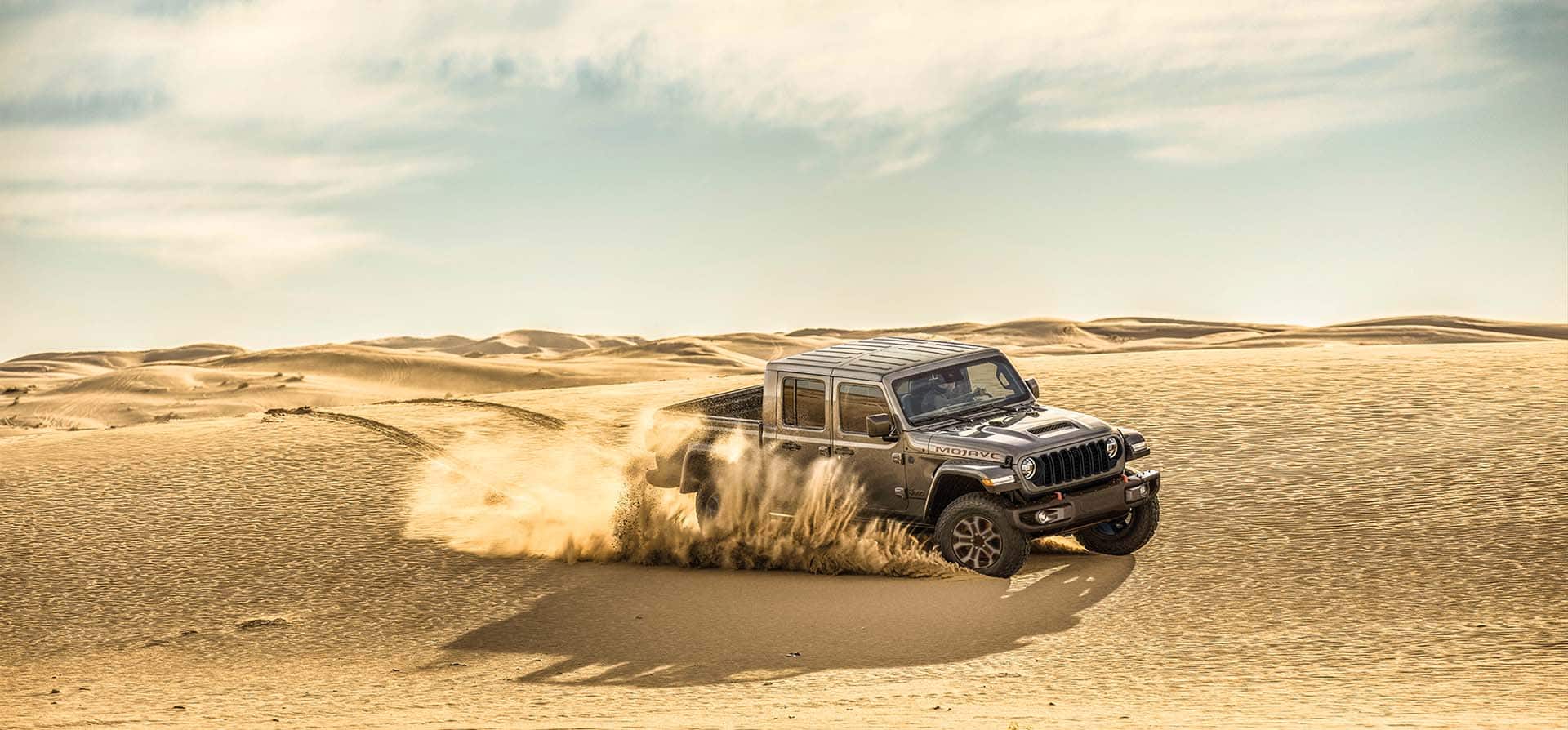 The Uconnect touchscreen in the 2025 Jeep Gladiator displaying one of the Off-Road Adventure Guides.