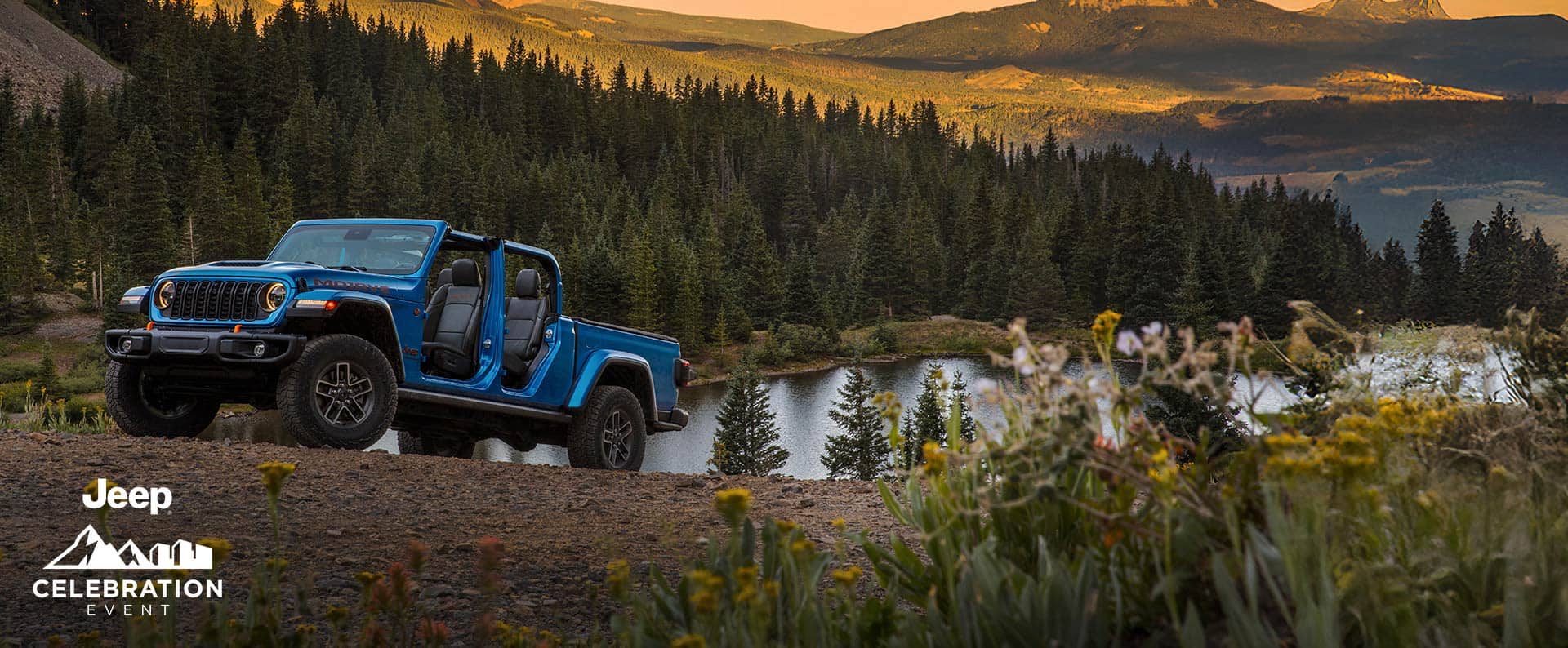 An olive green 2025 Jeep Gladiator Rubicon X travailing through deep snow off-road, in the mountains. Celebration event.