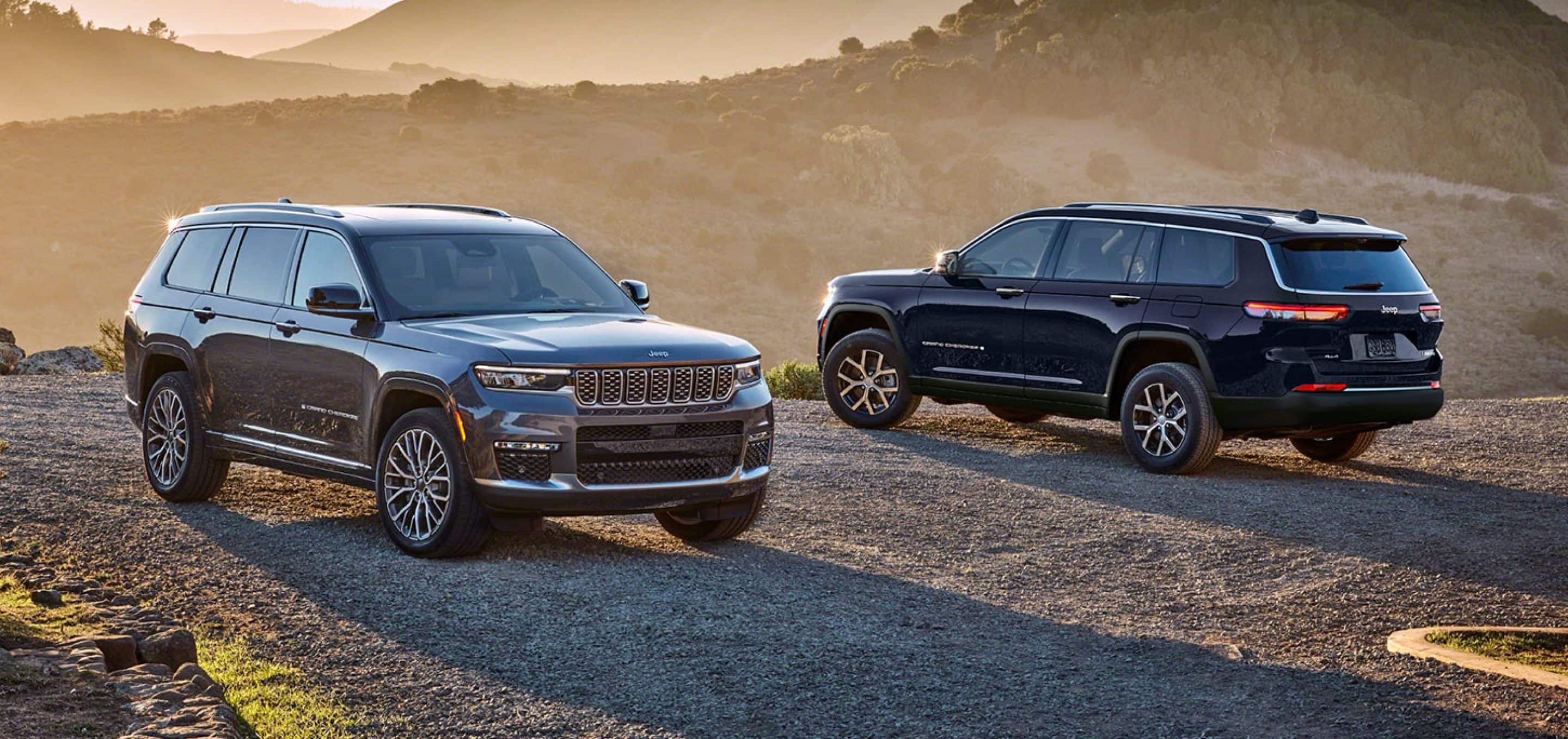 Two 2025 Jeep Grand Cherokee's parked on desert cliffside