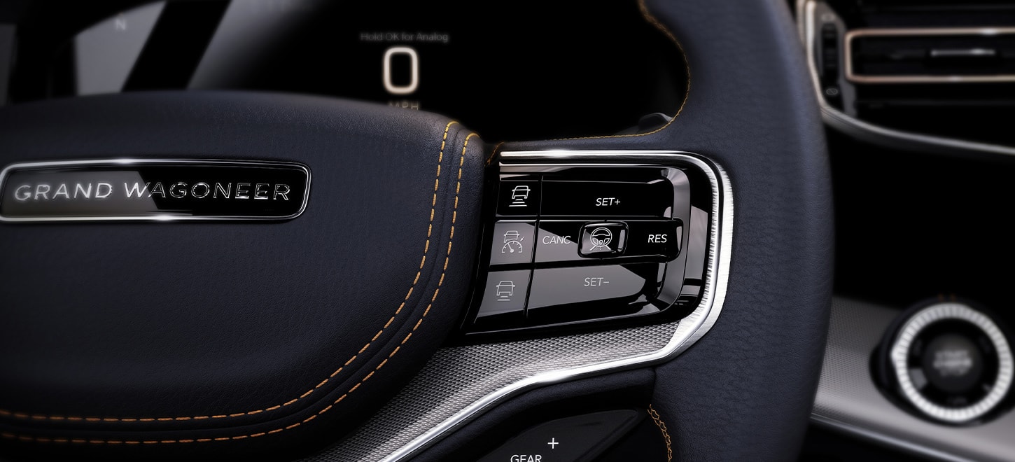 A close-up of the steering wheel-mounted controls in the 2025 Jeep Grand Wagoneer.
