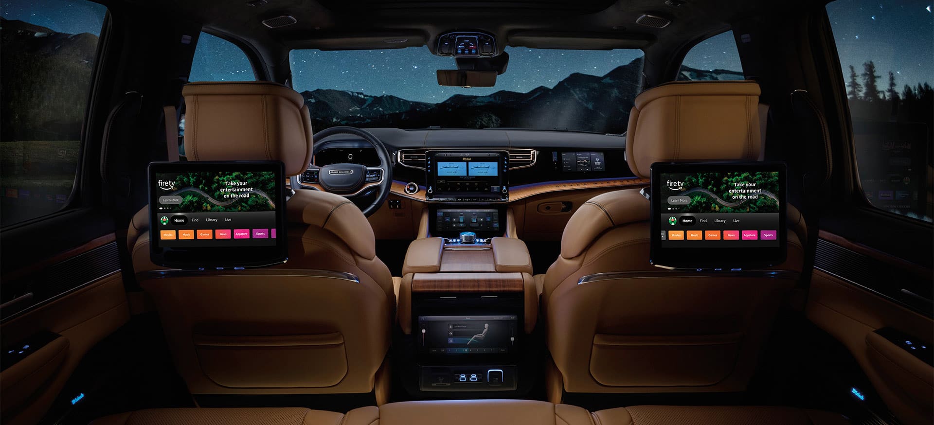 The second row of the 2025 Jeep Grand Wagoneer Series 3 with the two front seatback-mounted touchscreens displaying Amazon Fire TV selections.