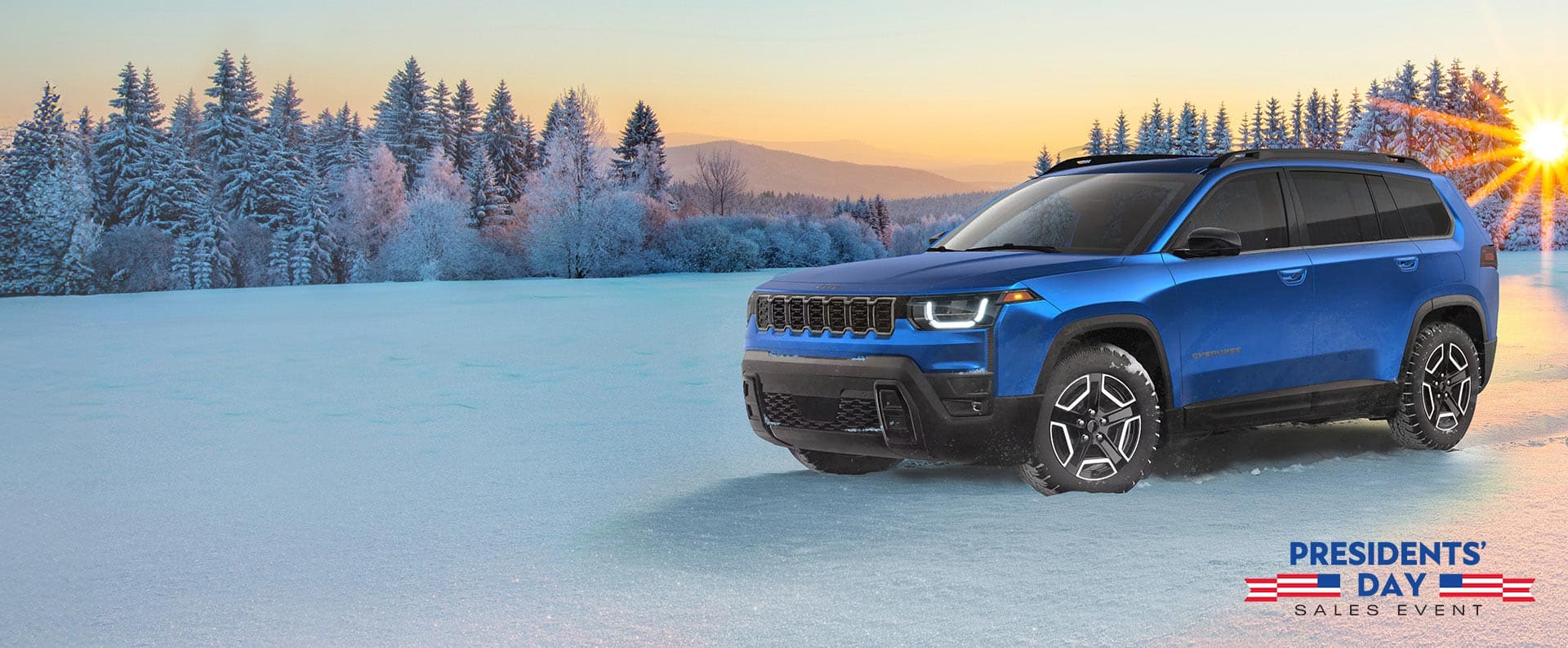 A driver-side front angle of a blue 2026 Jeep Cherokee Laredo parked on a snow-covered clearing at sunrise, with a forest in the background. The Presidents' Day Sales Event.