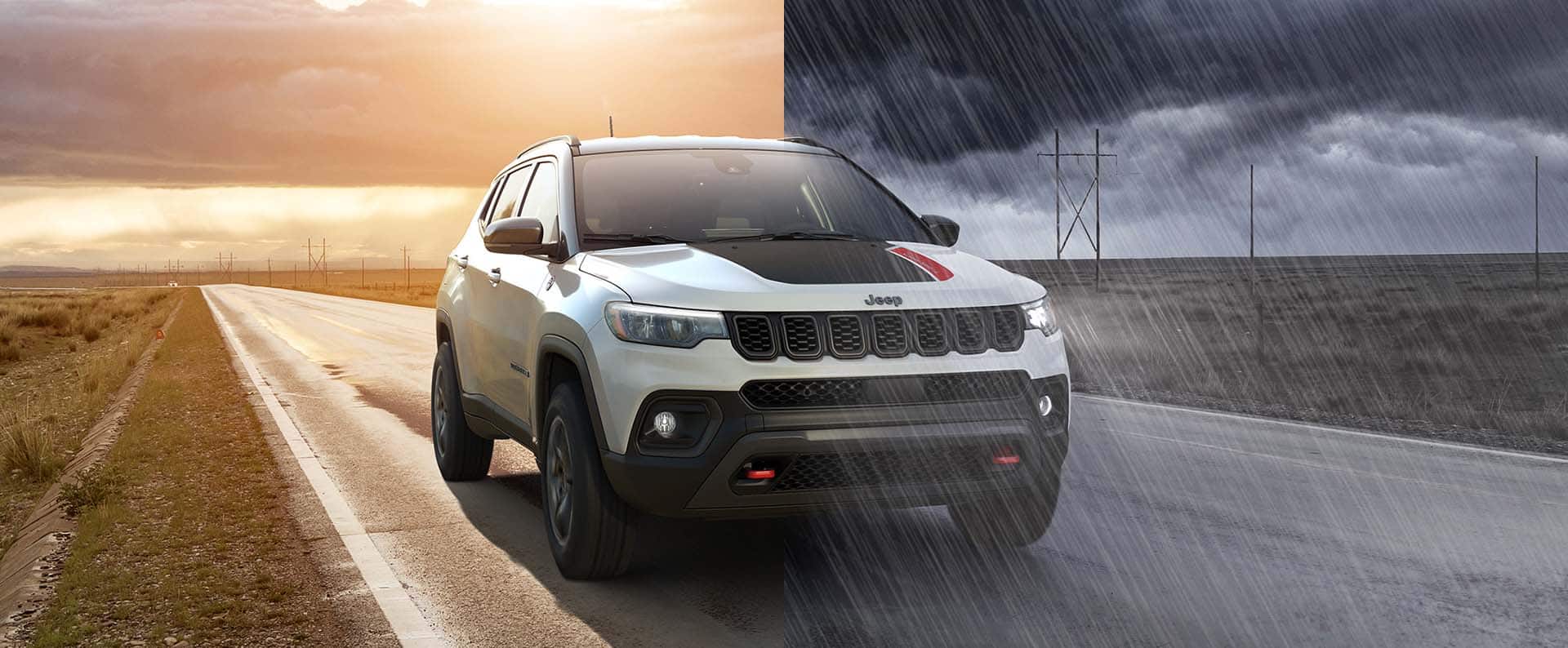 A split-screen of a white 2026 Jeep Compass Trailhawk with black hood insert, traveling on a highway between two open fields. On the left, it is a clear day at sunset; and on the right, a dark, cloudy sky pours heavy rain on the highway.