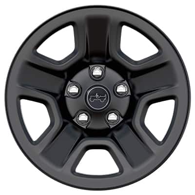 A wheel and tire on a blue 2026 Jeep Gladiator with seven other wheel designs selectable.