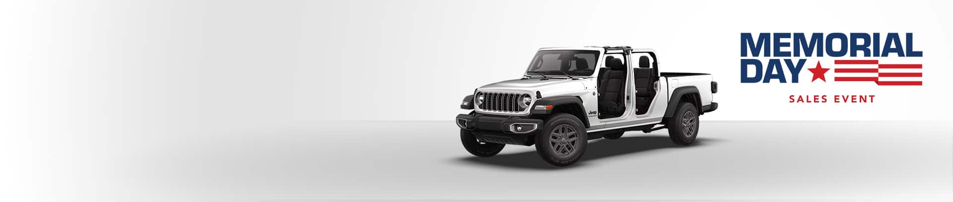 A white 2026 Jeep Gladiator Sport S with its doors and top removed. Memorial Day Sales Event.