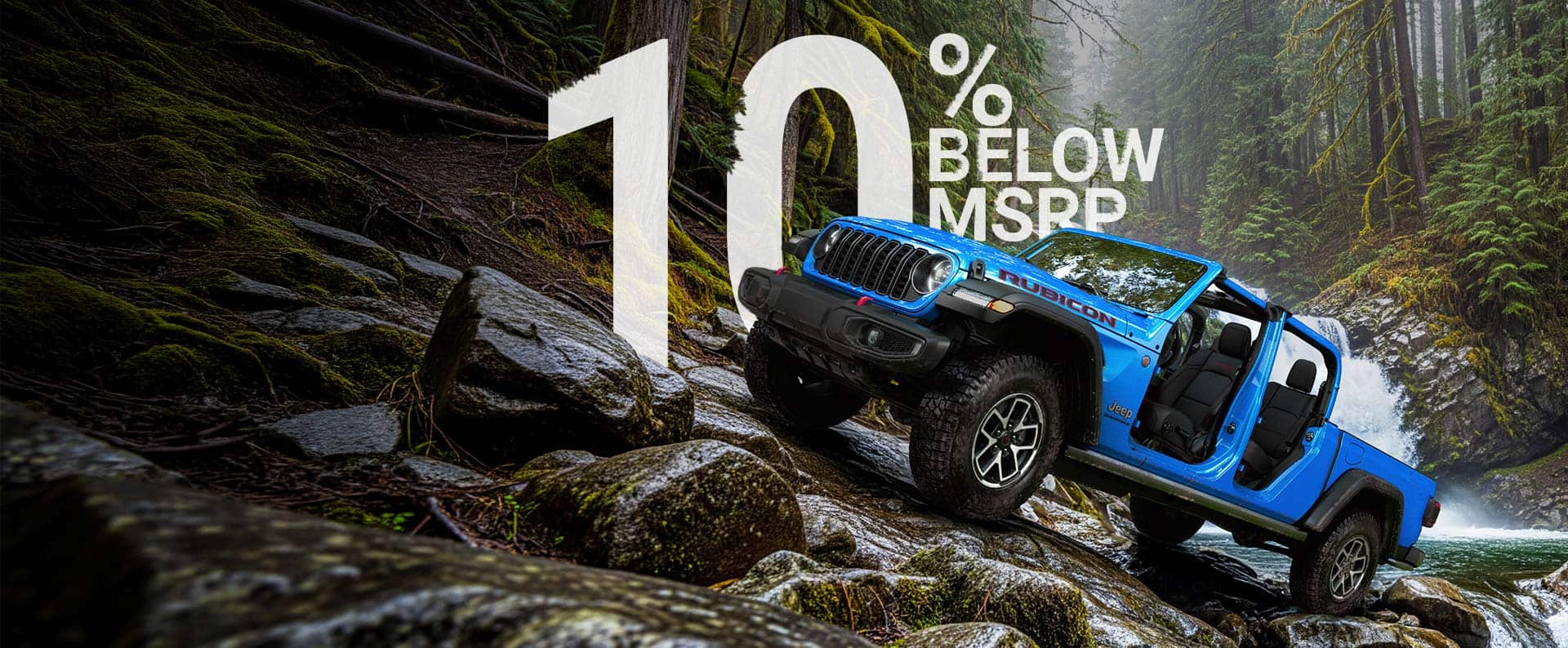 A blue 2026 Jeep Gladiator Rubicon with its doors and top removed, parked on a steep, rocky trail, just above a rapid stream with a waterfall in the background. Fall Event.