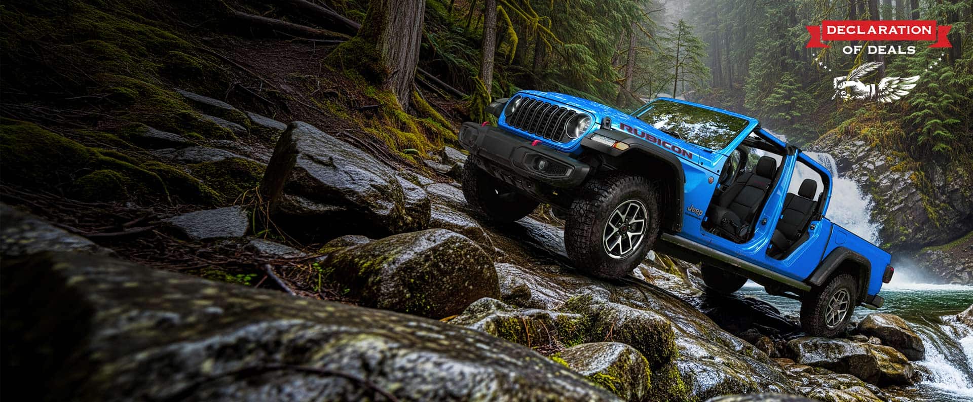 A blue 2026 Jeep Gladiator Rubicon with its doors and top removed, parked on a rocky hill, just above a stream. Declaration of Deals.