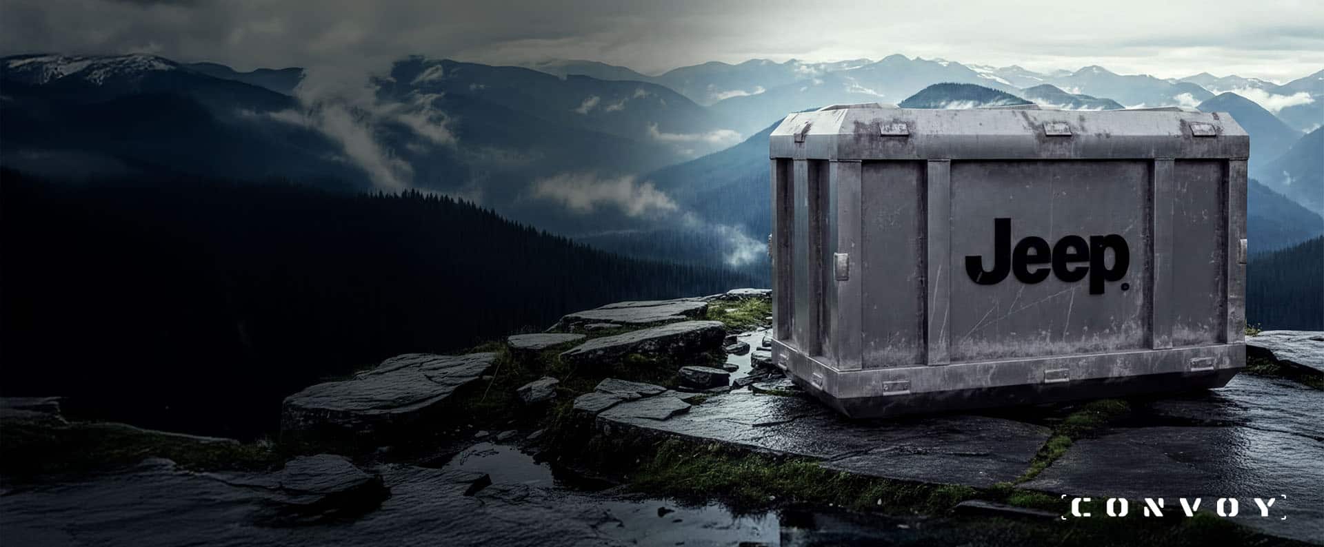 A gray steel crate with the Jeep Brand logo imprinted on its side sits atop the edge of a cliff, with mountains of forests in the background. Convoy.