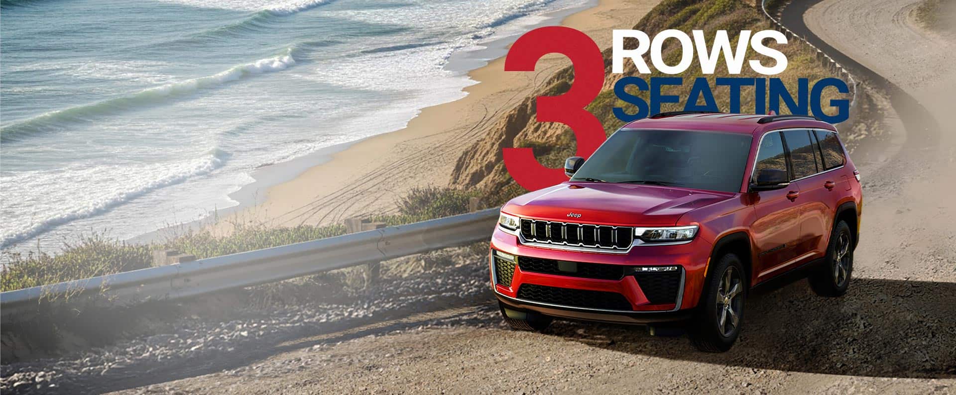 A red 2026 Jeep Grand Cherokee L Limited traveling on a beachfront road near the shoreline. Three rows of Seating. Drive Into Fall America’s Sales Event