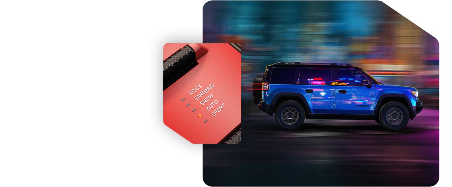 A blue 2026 Jeep Recon Moab traveling on a city street at night and the Selec-Terrain Traction Management System drive mode set on Auto.