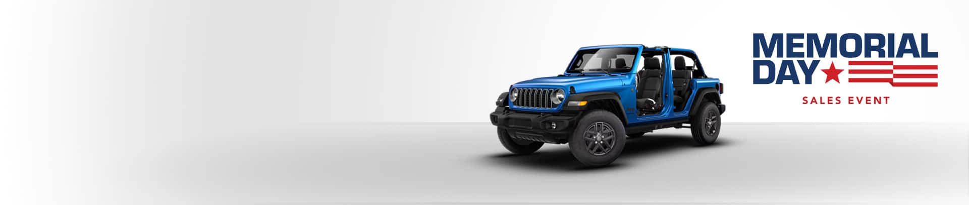 A blue 2026 Jeep Wrangler Sport two-door with its doors and top removed. Memorial Day Sales Event.
