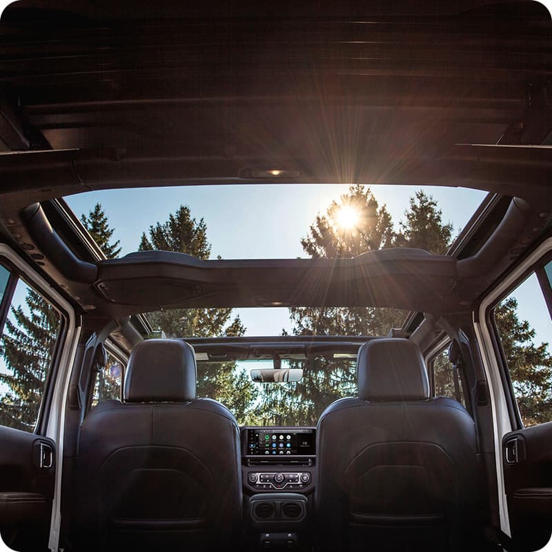 2026 Jeep Wrangler open-air driving showcasing IP-rated touchscreen durability