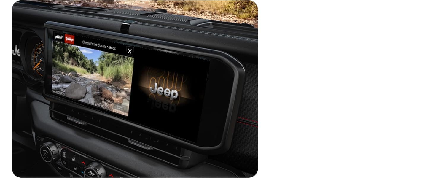 A close-up shot of the 12.3-inch touchscreen of a 2027 Jeep Gladiator using its TrailCam Off-Road Camera.