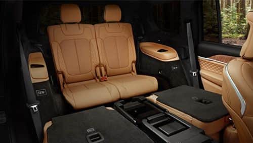 The interior of the 2027 Jeep Grand Cherokee L Summit with the second-row seats folded and the third-row seats upright.