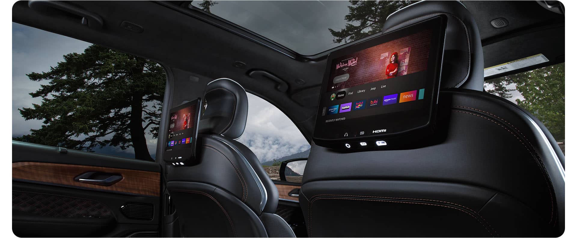The seatback-mounted touchscreens in the second row of the 2027 Jeep Grand Cherokee displaying Amazon Fire TV selections.