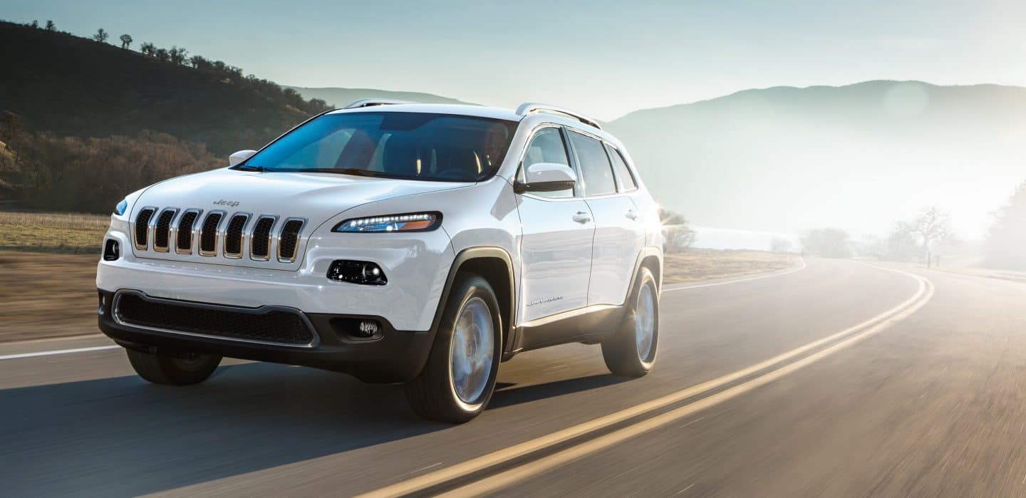 Jeep Cherokee being driven on a highway.