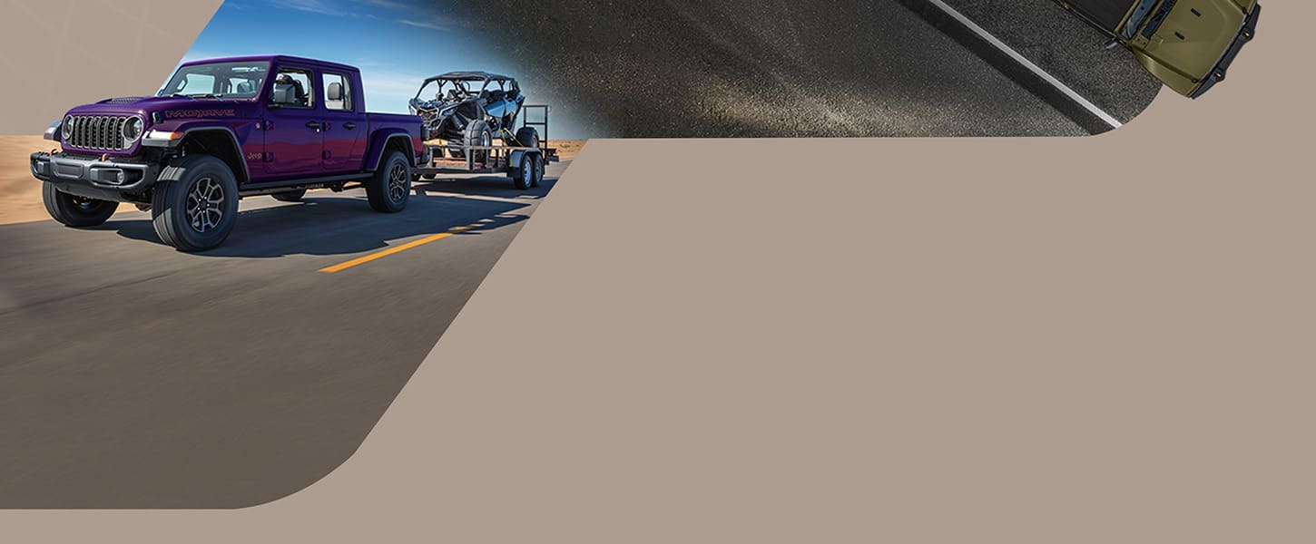 A purple 2026 Jeep Gladiator Mojave X traveling down a highway, towing a dune buggy.