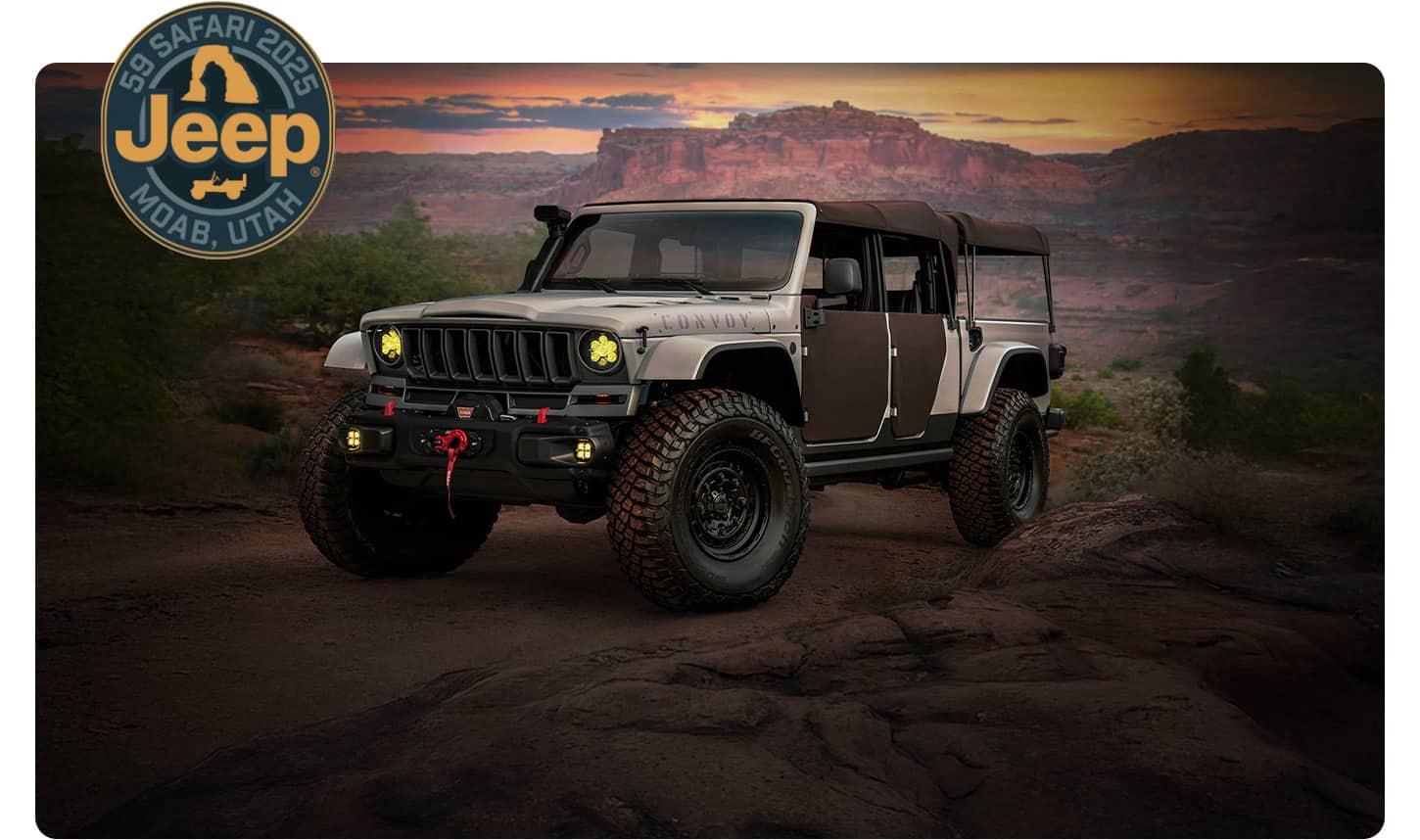 A driver-side front angle of a 2025 Jeep Gladiator Convoy Concept vehicle in shades of gray on a trail off-road. 59 Jeep Safari 2025, Moab, Utah.