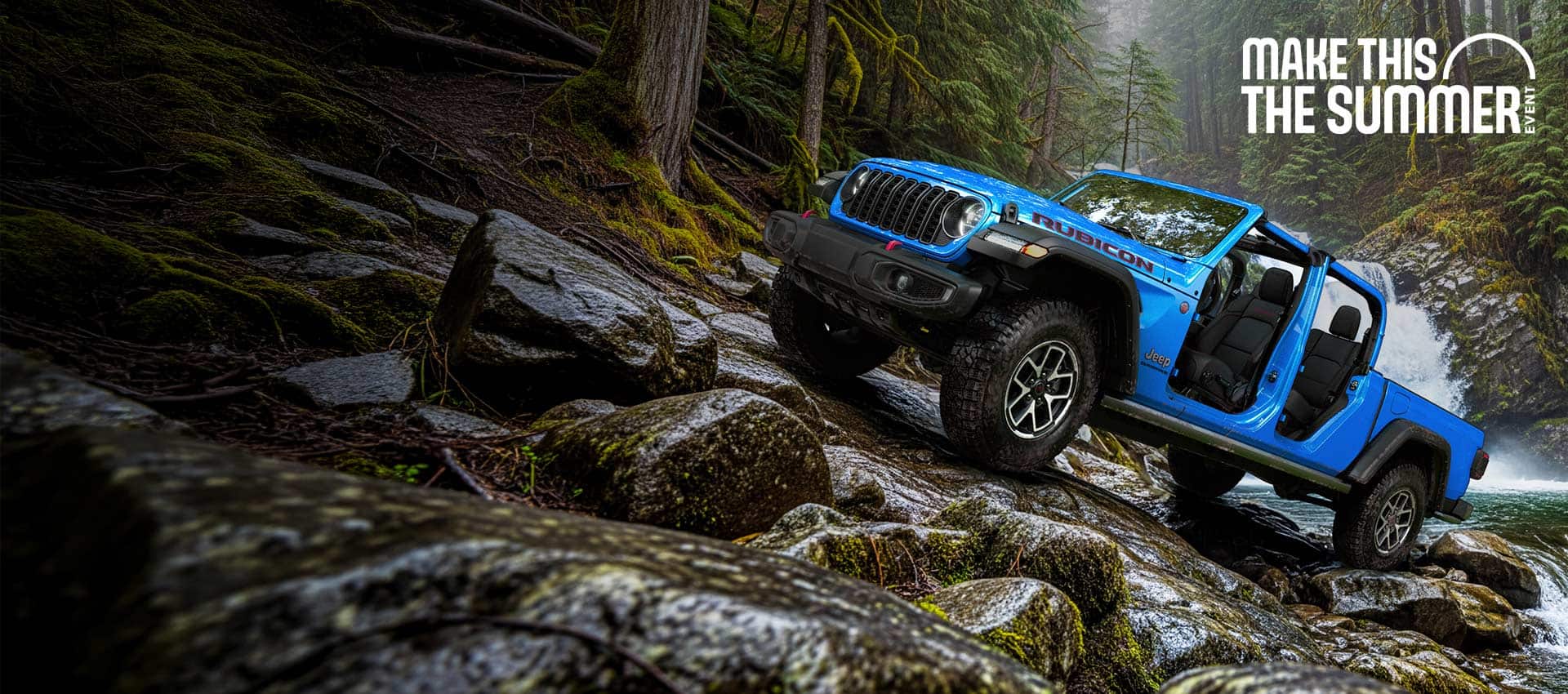 A blue 2026 Jeep Gladiator Rubicon with its doors and top removed, parked on a steep, rocky trail, just above a rapid stream with a waterfall in the background. 4th of July Sales Event.