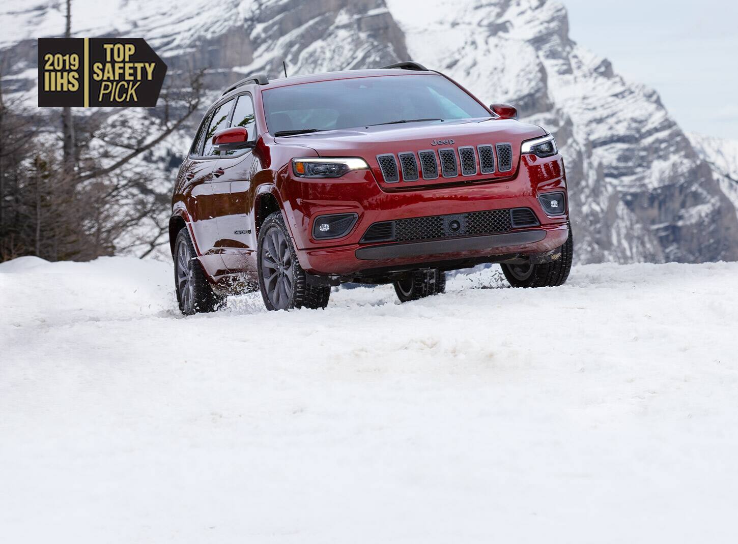 The 2019 IIHS Top Safety Pick logo and the 2019 Jeep Cherokee.