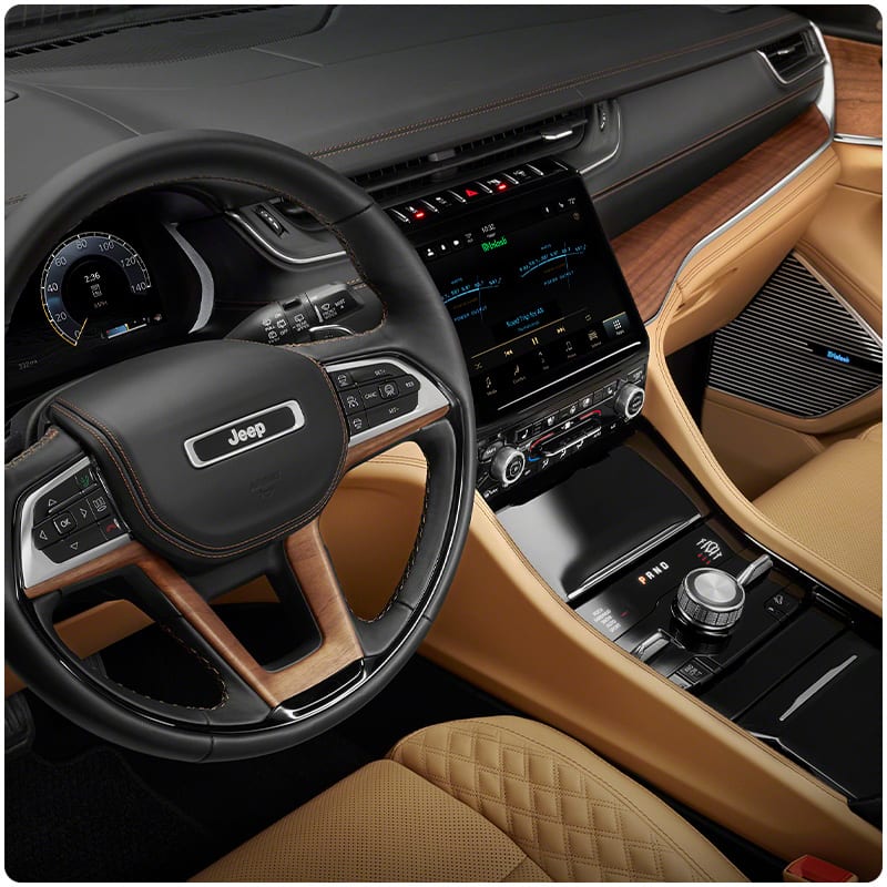 A close-up of the steering wheel in the 2021 Jeep Grand Cherokee L.