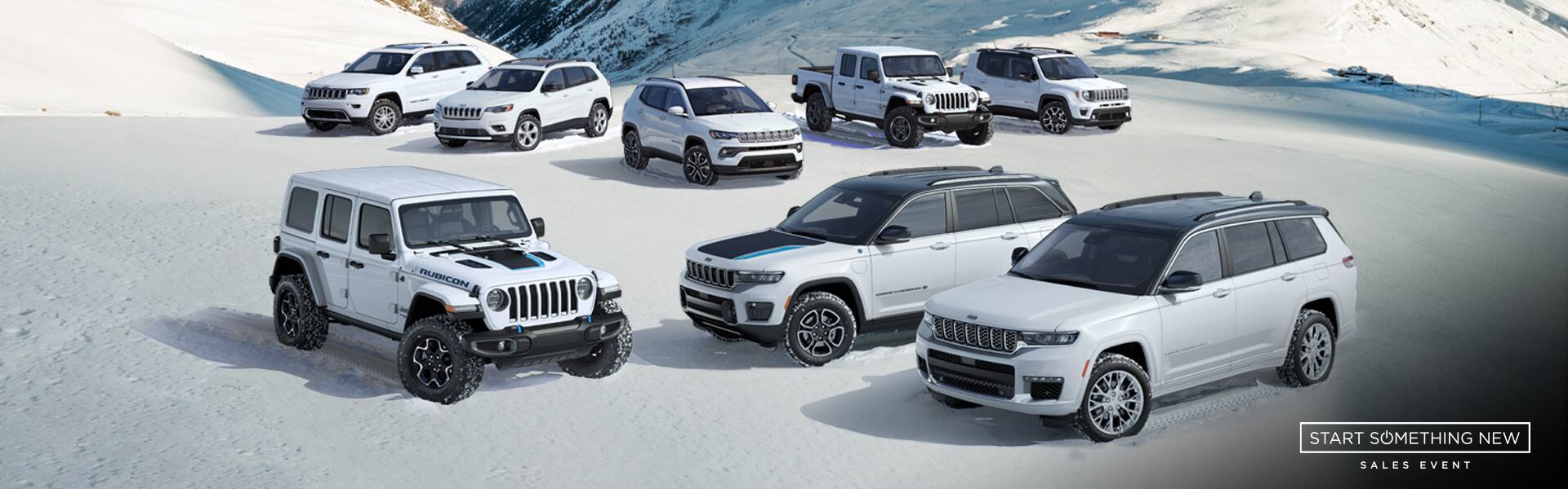 Start something new sales event. A lineup of eight 2021 Jeep Brand vehicles on a snowy mountain.