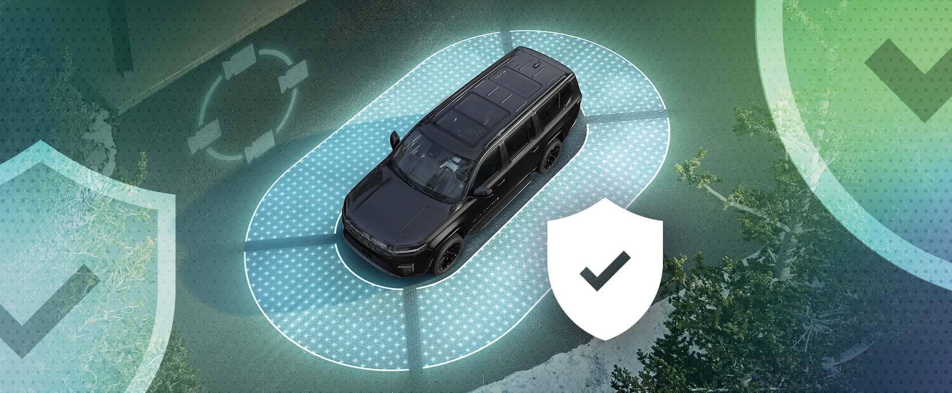 An overhead angle of a 2026 Jeep Grand Wagoneer encircled by a lighted oval with a checkmark inside of a shield nearby the SUV.
