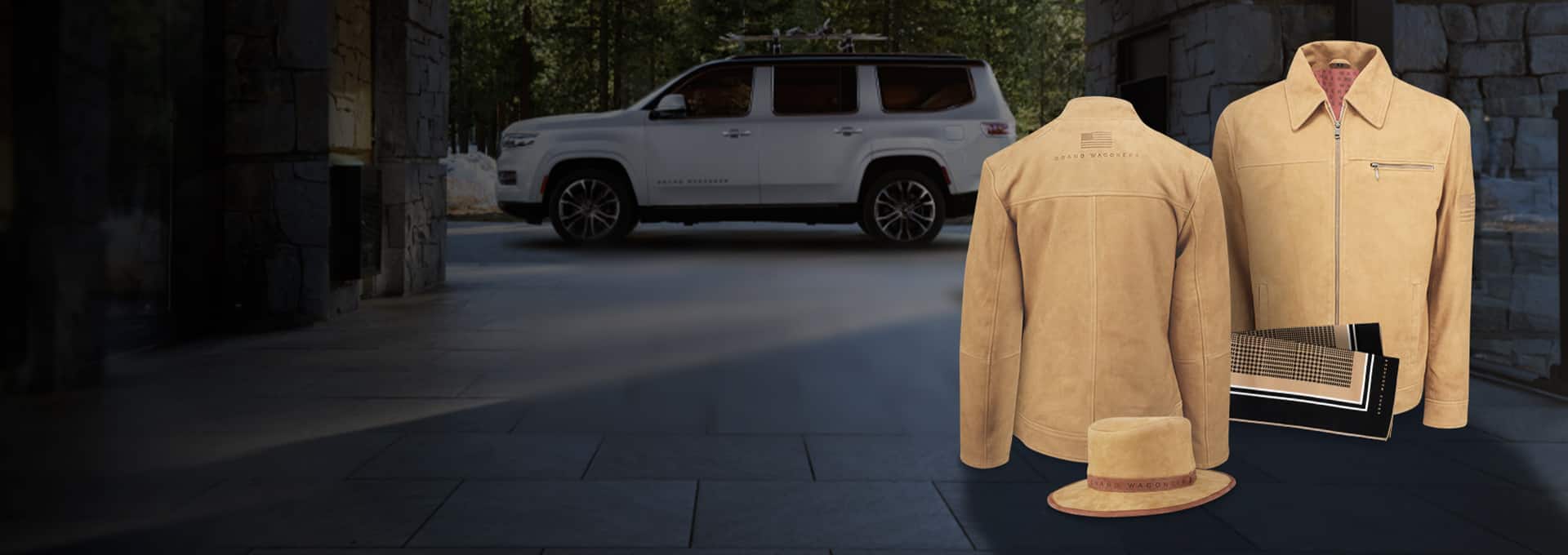A set of Grand Wagoneer branded apparel including a woman's suede jacket, men's suede jacket, men's suede fedora and silk scarf.