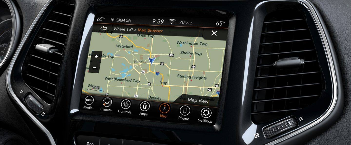 The touchscreen in the 2021 Jeep Cherokee displaying a street map of the surrounding area onscreen.