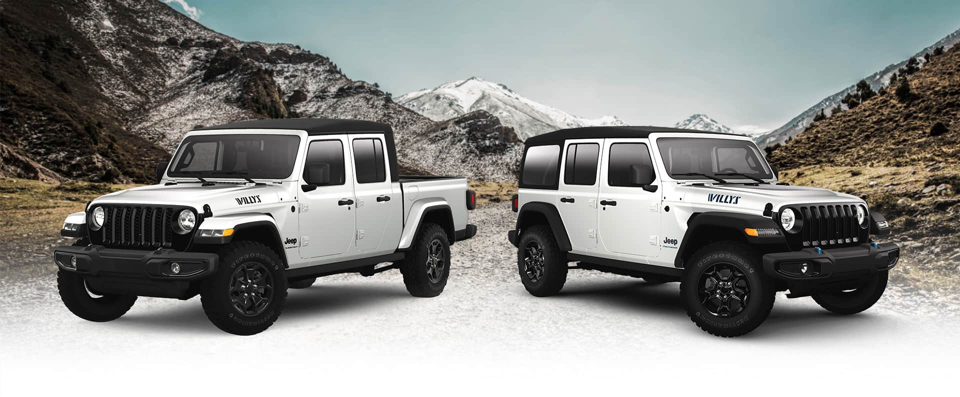 A white 2023 Jeep Gladiator Willys Edition and white 2023 Jeep Wrangler Willys 4xe Edition parked in a clearing, with mountains on both sides and in the background.