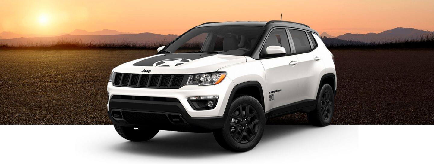 A three-quarter front view of a 2021 Jeep Compass Freedom Edition in White, one of four selectable colors.