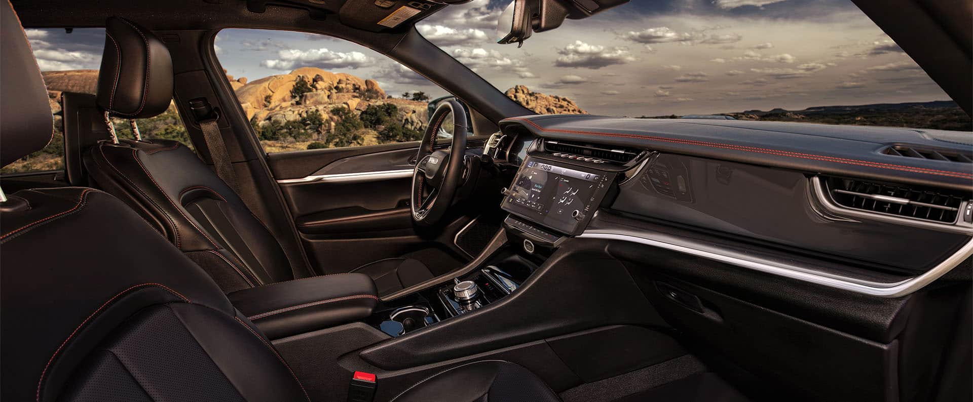 The front row in the 2026 Jeep Grand Cherokee from the perspective of the passenger side.