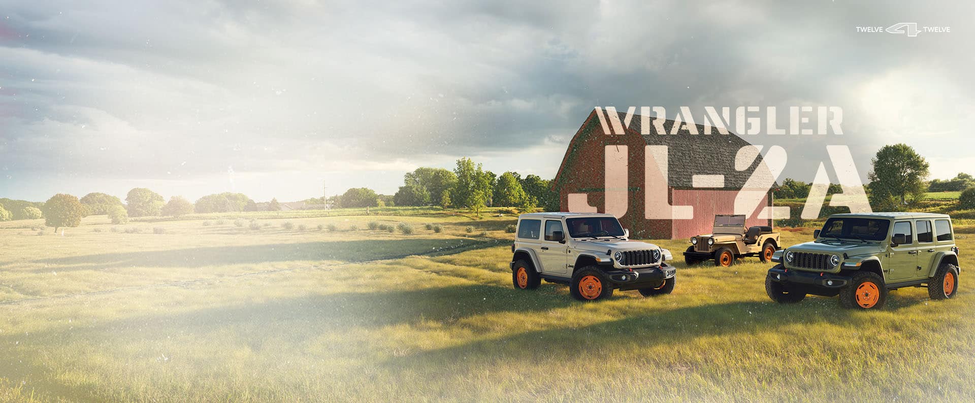 Tan and green 2027 Jeep Wrangler JL-2A vehicles sit parked in a grassy field, throwing long shadows in the afternoon light. A vintage Jeep Wrangler sits behind them, and behind that is a red barn. The words WRANGLER and JL-2A are superimposed between the vintage Wrangler and the barn.