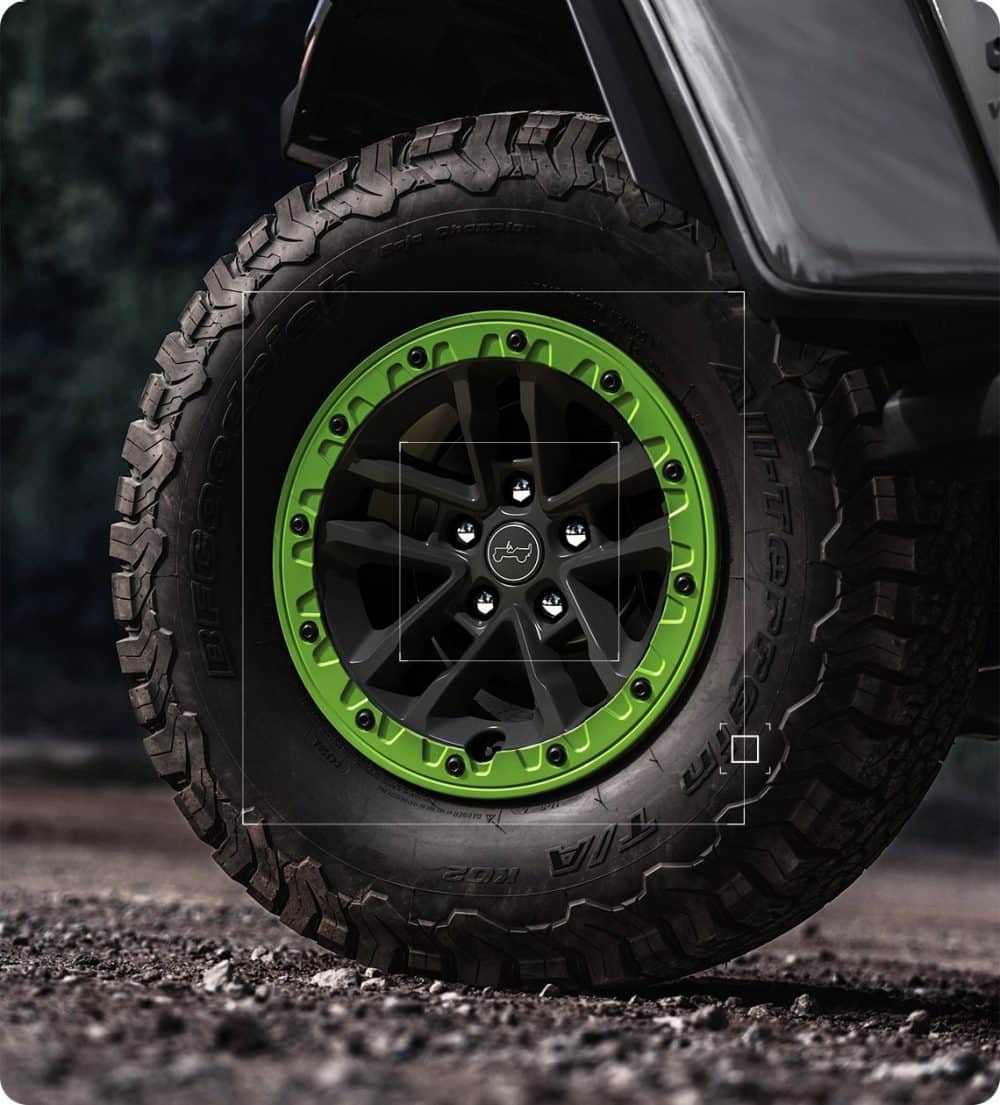 Gecko green beadlock ring on a Wrangler Switchback wheel with an all-terrain tire