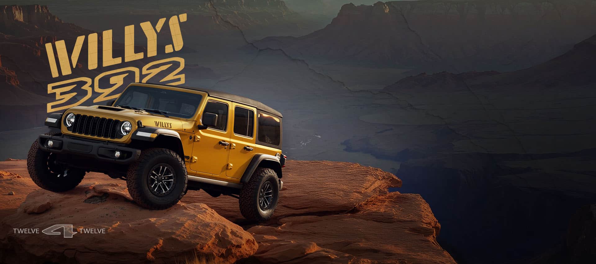 A driver-side front angle of a gold 2026 Jeep Wrangler Willys 392 crawling up a steep, rocky trail. Willys 392. 12 for 12.