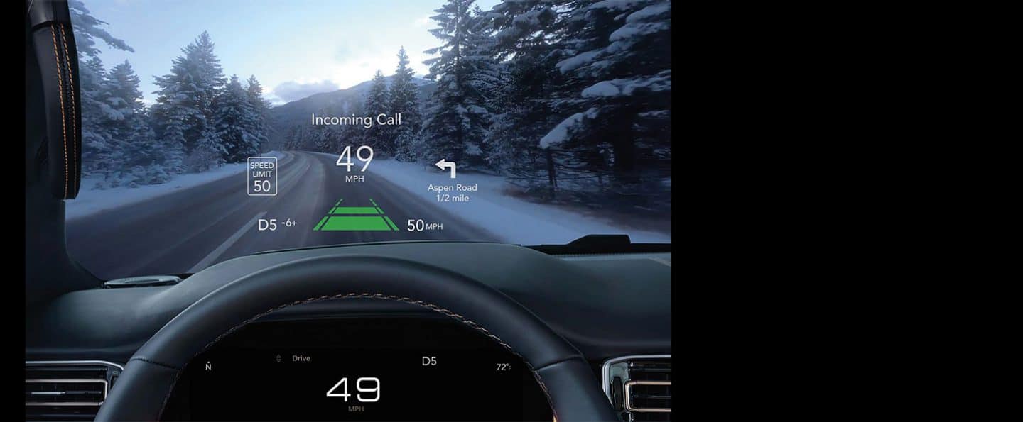 The current speed limit, vehicle's speed, upcoming navigation and incoming call, all displayed on the windshield of the 2024 Wagoneer with the Head-Up Display.