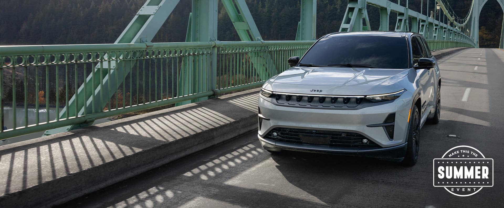 A white 2025 Jeep Wagoneer S Launch Edition traveling across a bridge. Make This The Summer Event.