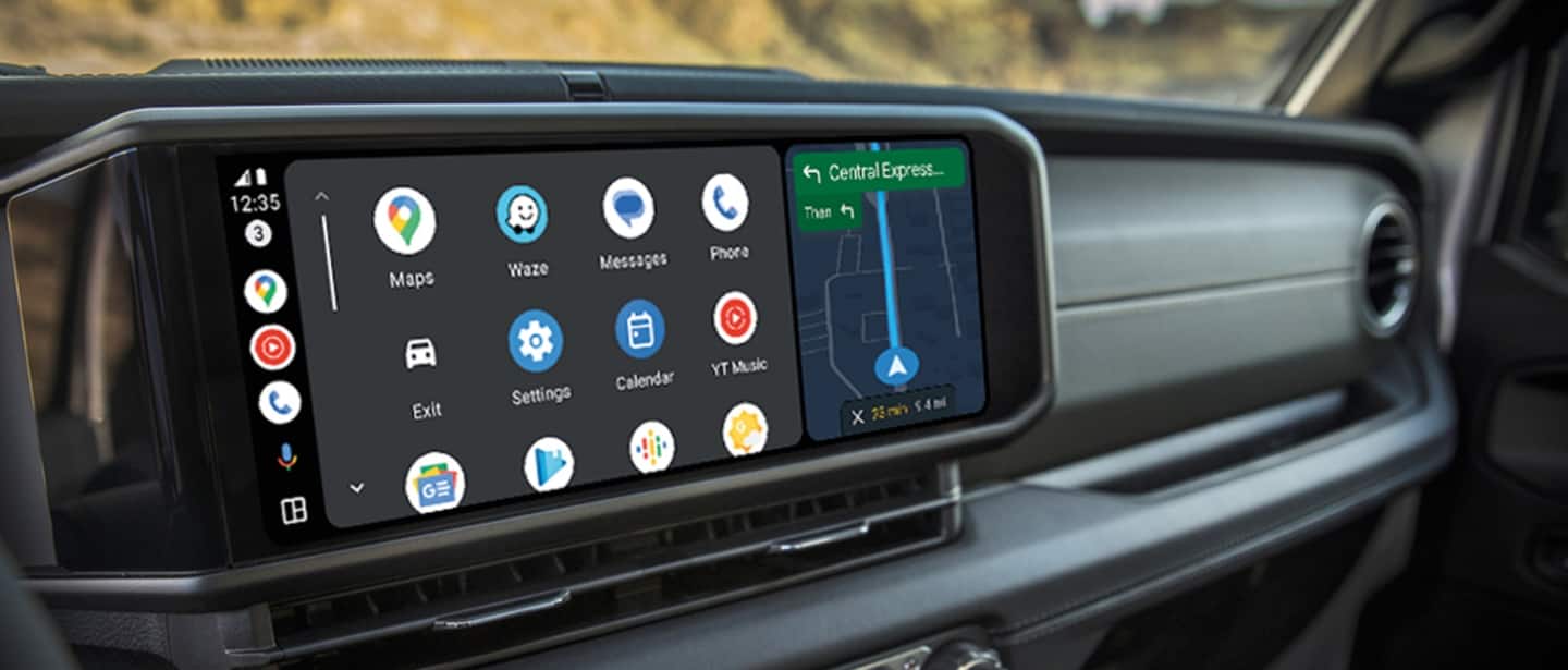 The Uconnect touchscreen in a 2024 Jeep Wrangler displaying a set of widgets and a navigation map.